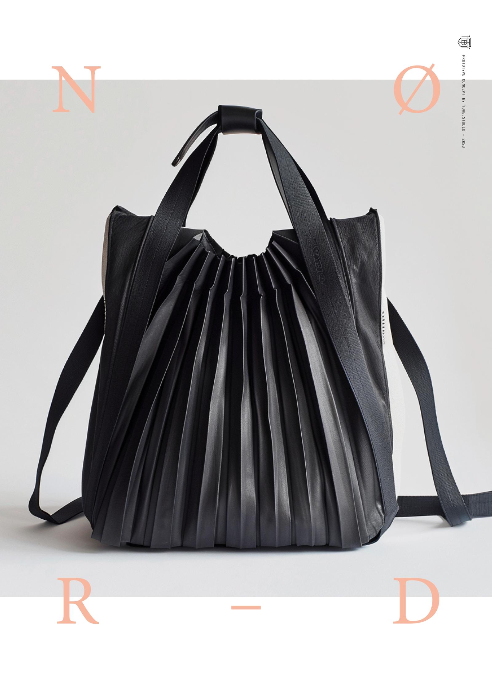 “Black sculptural handbag with dynamic pleated structure and adjustable straps, representing experimental fashion design and modular luxury accessories.”